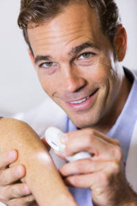 Skin Cancer Dermatologist examining patient