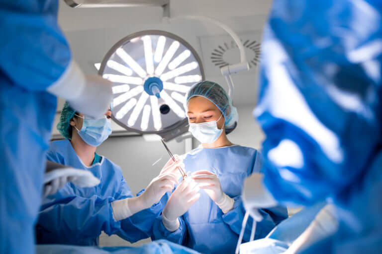 Team of professional doctors performing Mohs Surgery